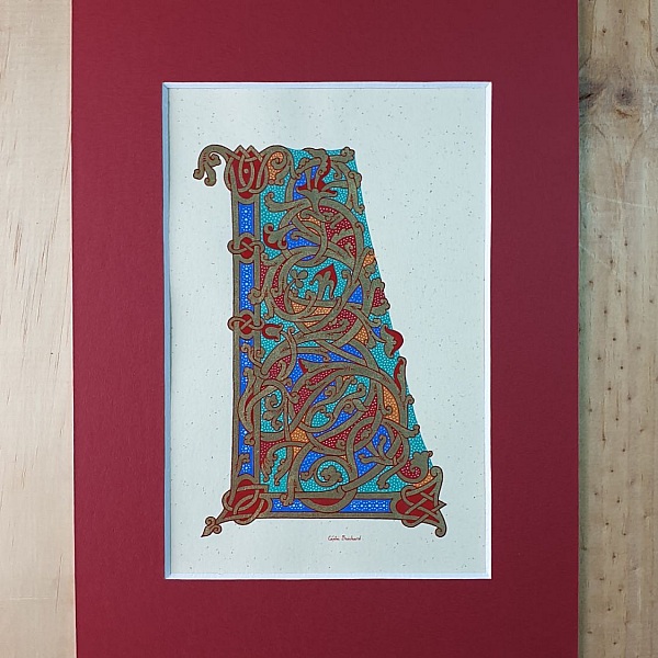 Lettre L enluminée style ottonien avec passe-partout rouge.