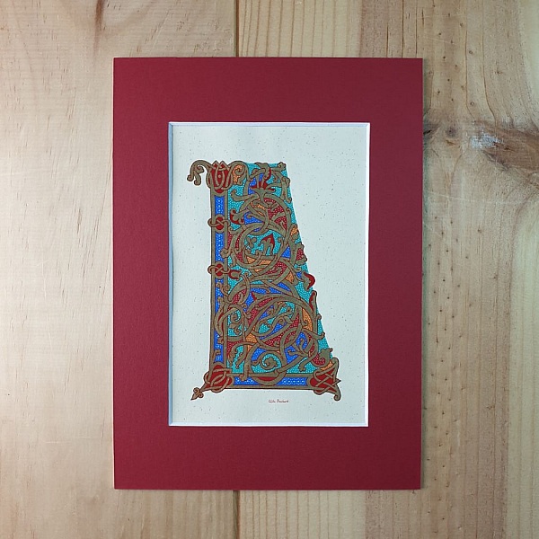 Lettre L enluminée style ottonien avec passe-partout rouge.