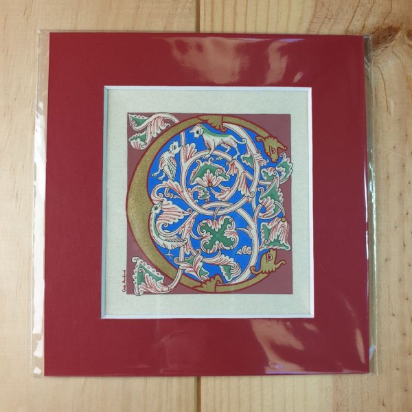 Lettera C miniata in stile romanico